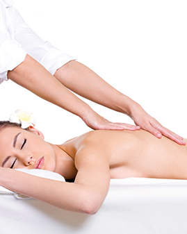A photo of a woman being massaged