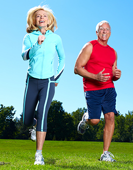 An elderly couple jogging