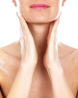 A photo of a woman putting on make-up